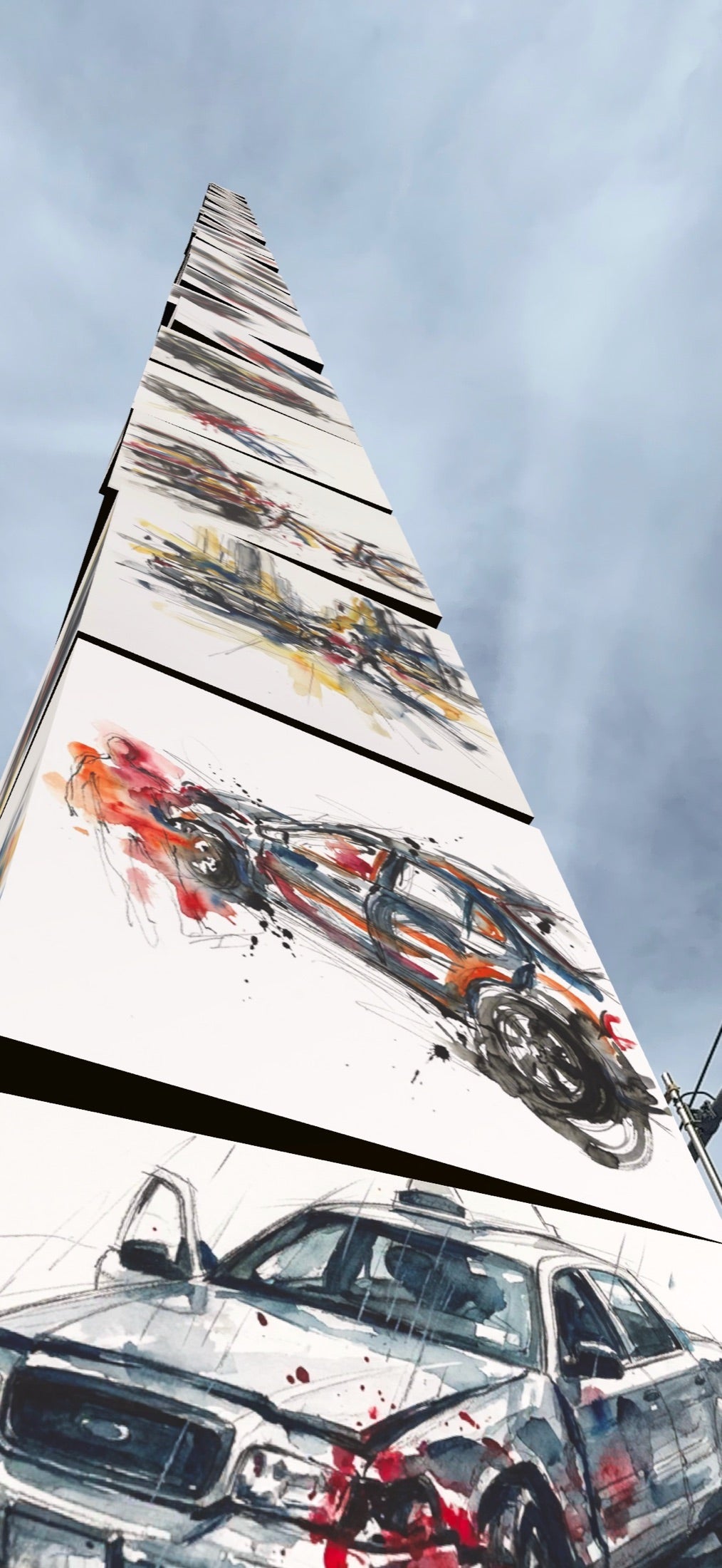 A vertical Crashscape tower of painted crash cubes rising into the sky